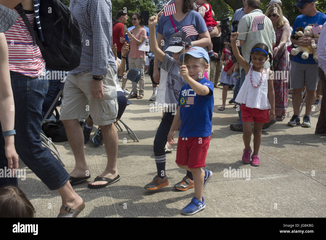 Chicago, IL, USA. 4th July, 2017. The Chicago History Museum hosted its annual 4th of July Celebration with a concert and children's parade. The crowd enjoyed patriotic songs and a tribute to American service men and women. Uncle Sam (on stilts) was as popular as ever with people waiting in line to have their picture taken with him. Many in the crowd donned their red, white and blue outfits to honor the day Young and old alike enjoyed the celebration. Credit: Karen I. Hirsch/ZUMA Wire/Alamy Live News Stock Photo