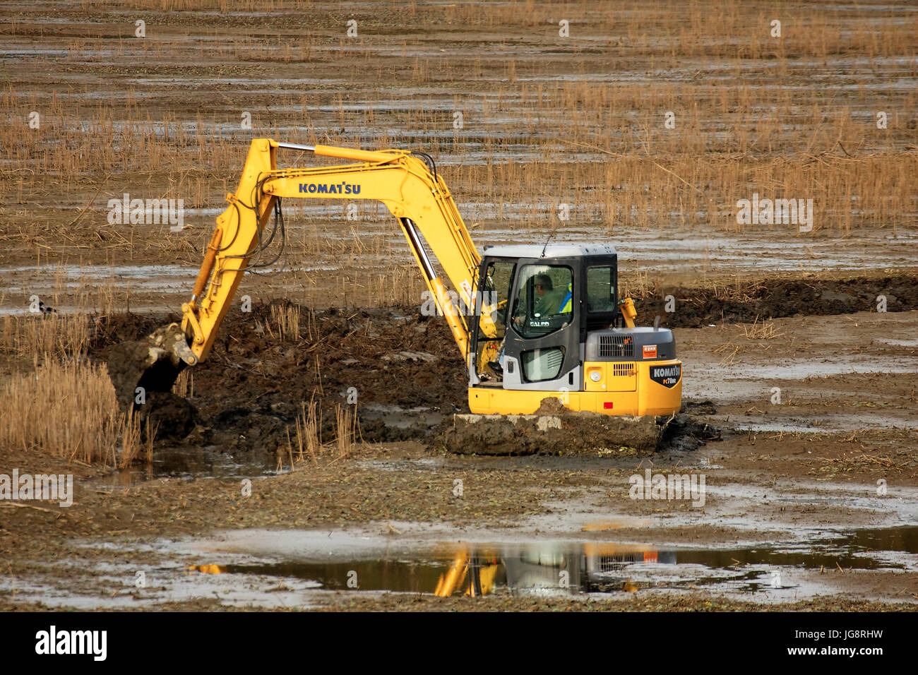 Excavator cleaning the pond in Crna Mlaka Stock Photo Alamy