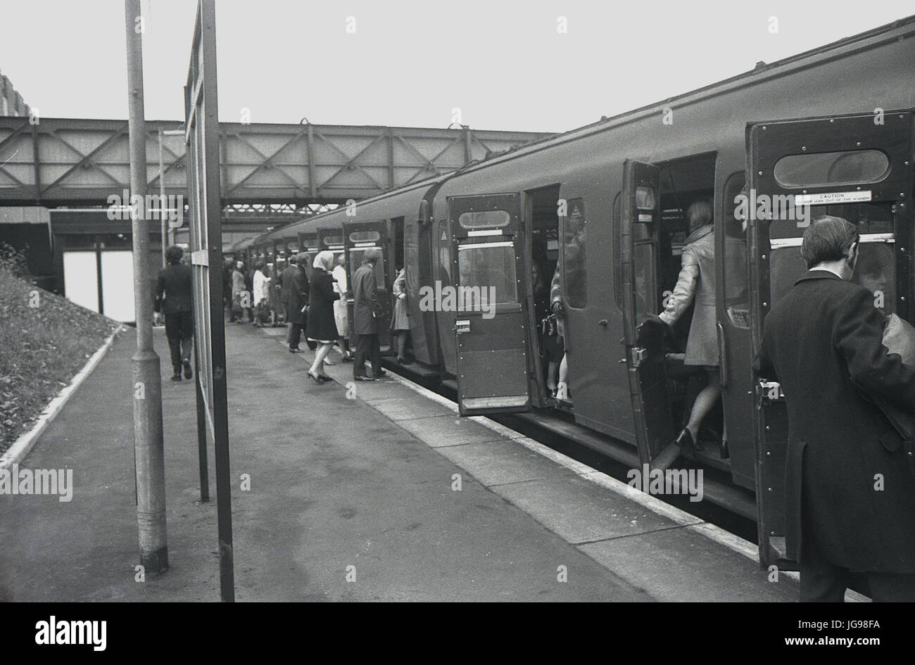 1972, British Rail, South East London, England, UK, Brockley train station, home to rail services from Southern Region. Picture shows commuters boarding train carriages from platform. Stock Photo