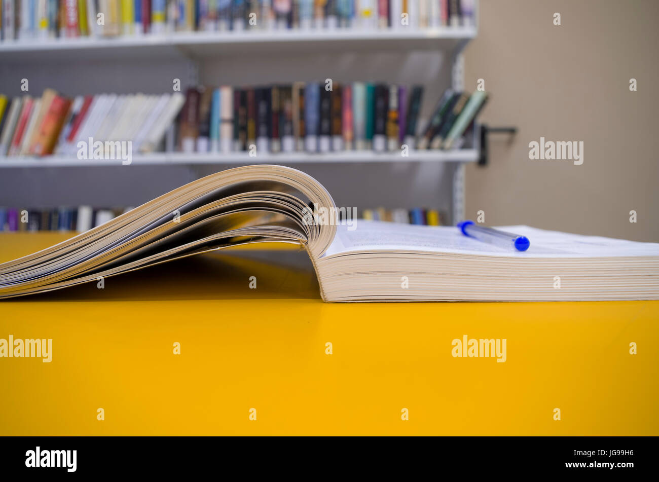 Study book opened, library Stock Photo - Alamy