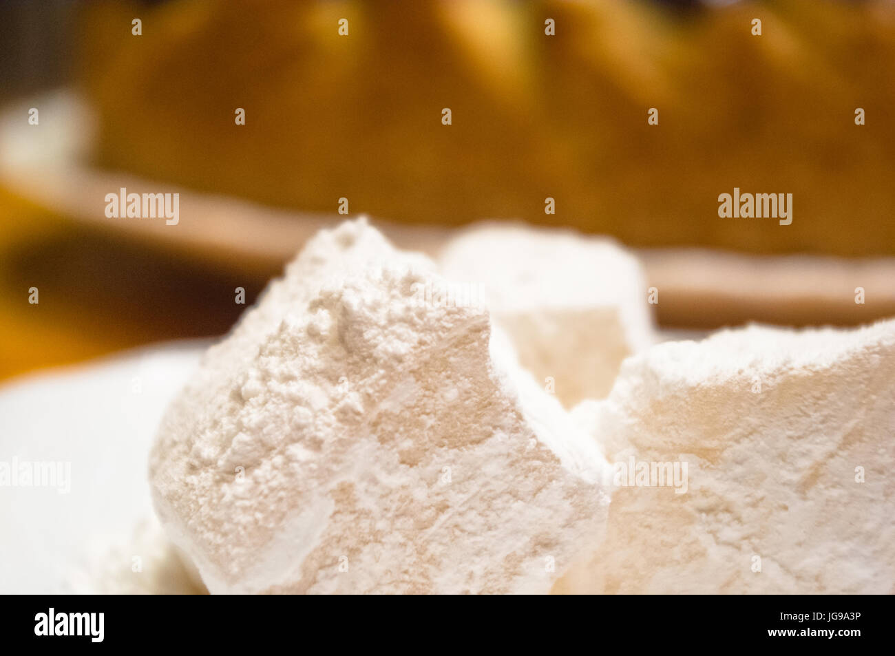 Rahat Comp Turkish delight or rahat-lokum on a white saucer, selective focus Stock ...