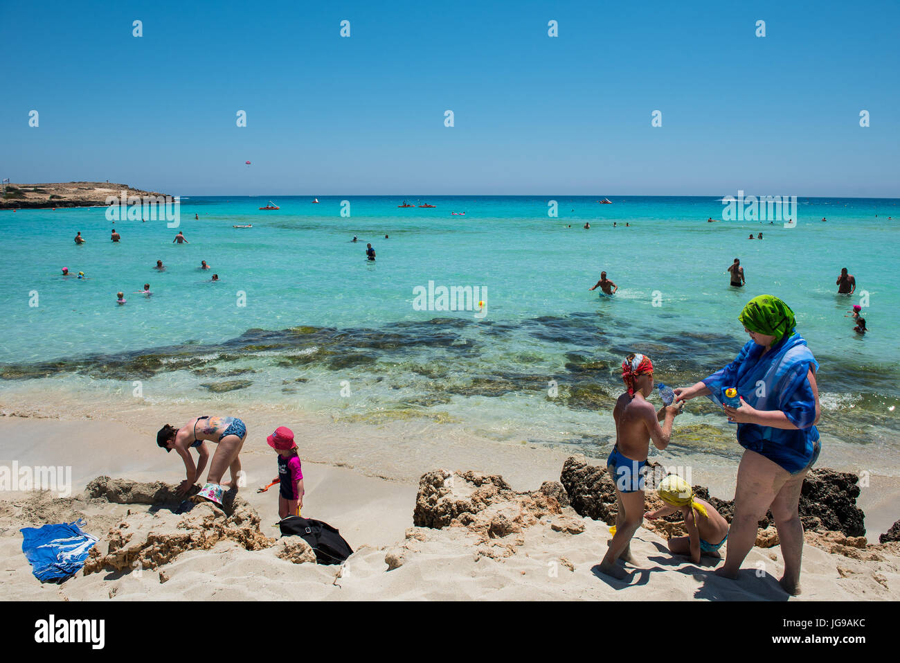 NISSI BEACH, AYIA NAPA, CYPRUS JUNE 15, 2017 Tourists relaxing on