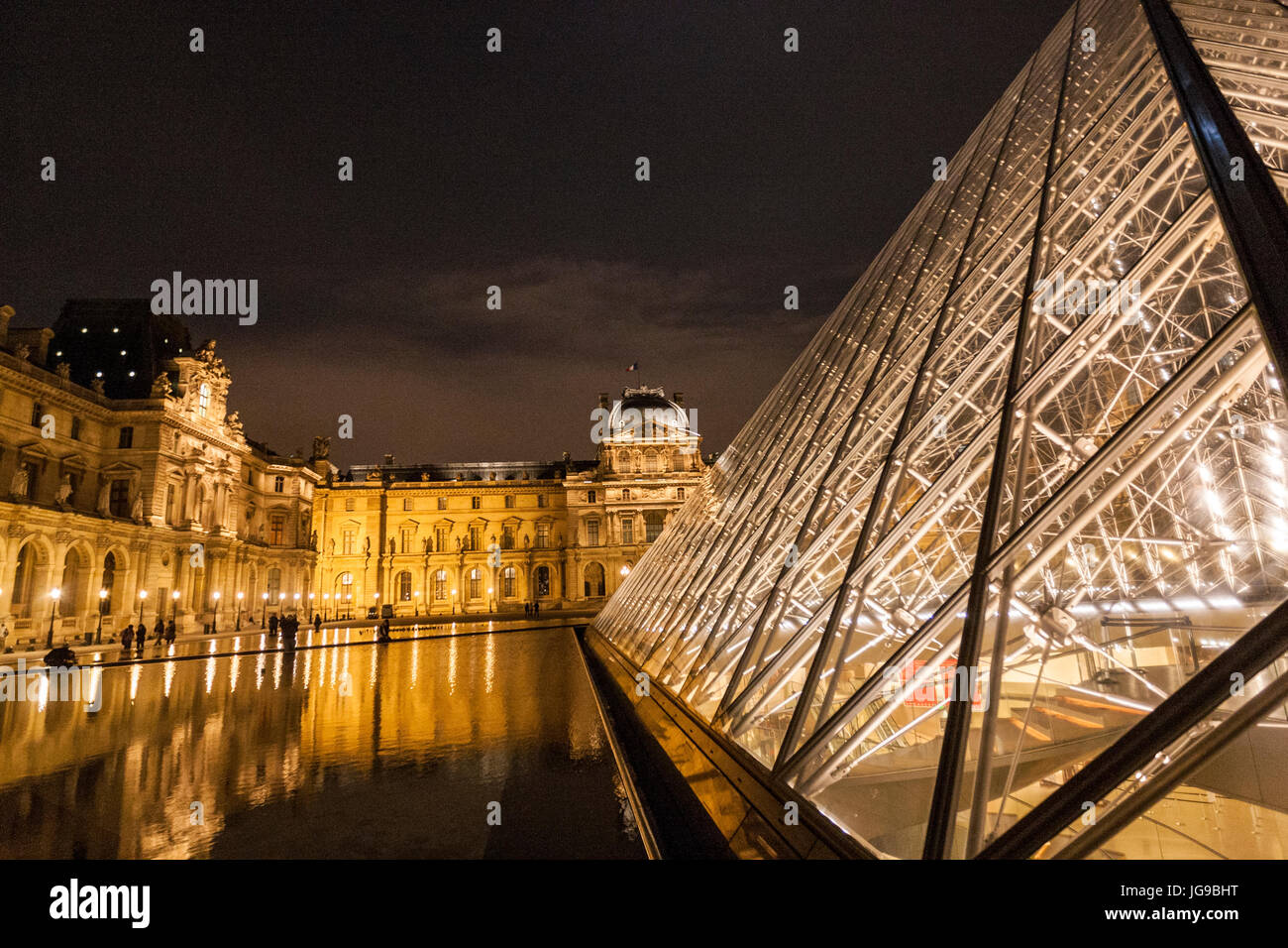 Louvre museum and Louvre Pyramid, architect I.M. Pei, at night, Paris, France Stock Photo