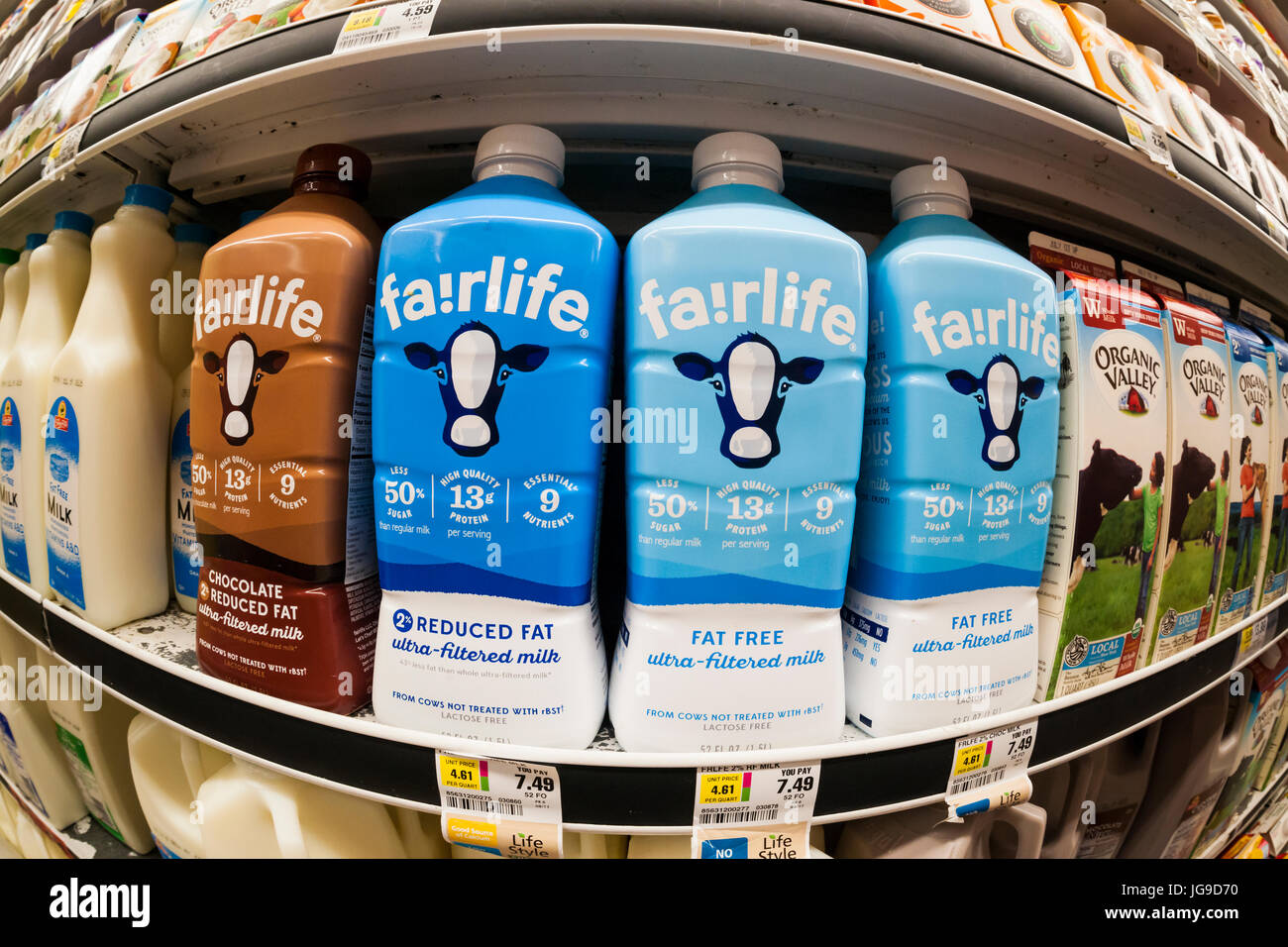 Containers of Coca-Cola's Fairlife premium 'supermilk' in a supermarket cooler in New York on Thursday, June 29, 2017. The premium beverage is lactose-free and contains more protein and calcium and less sugar than regular milk. The milk is filtered in a proprietary method removing the lactose and most of the sugar but leaving protein and calcium. It also costs about twice as much as regular milk. (© Richard B. Levine) Stock Photo