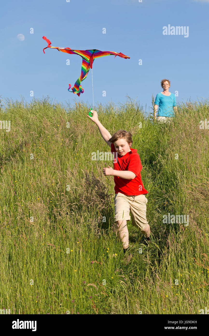mother and son flying kite, Bleckede, Lower Saxony, Germany Stock Photo