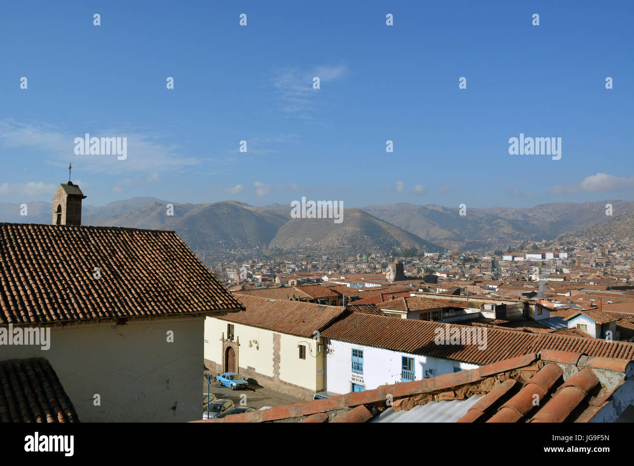 The tile roofs of Cusco Peru, a city of half a million, spread out across the valley floor. Stock Photo