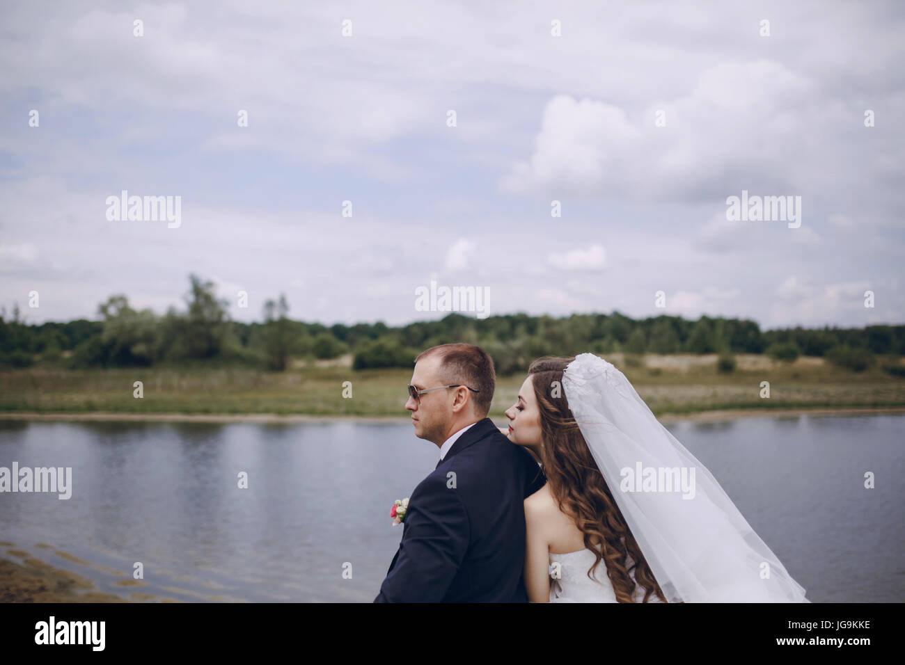 Bride and groom back view sitting hi-res stock photography and images ...