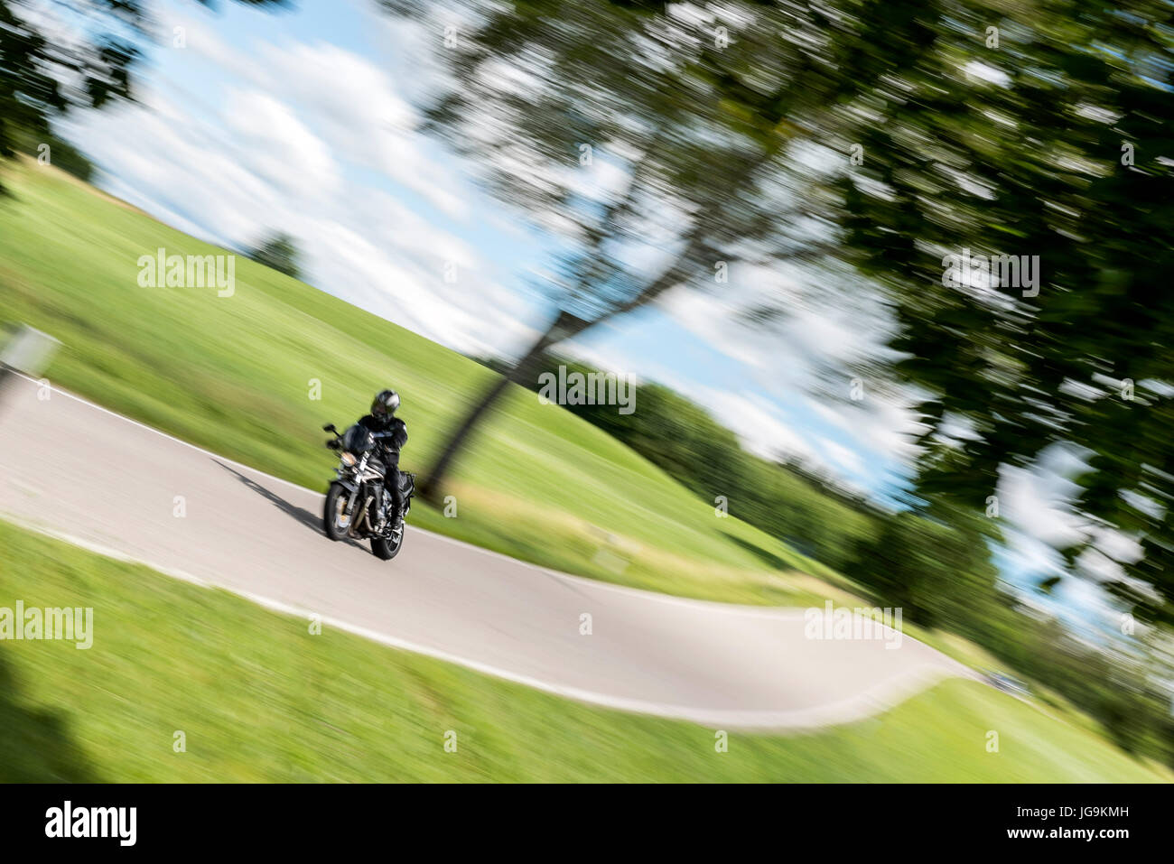 Motorcycle rider on the road Stock Photo - Alamy