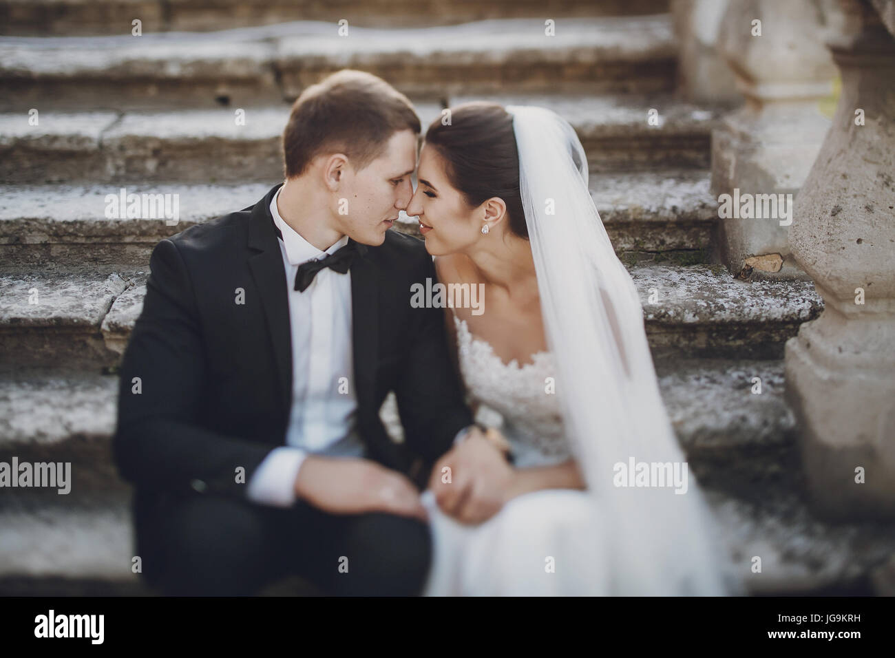 Bride sitting on stairs hi-res stock photography and images - Alamy