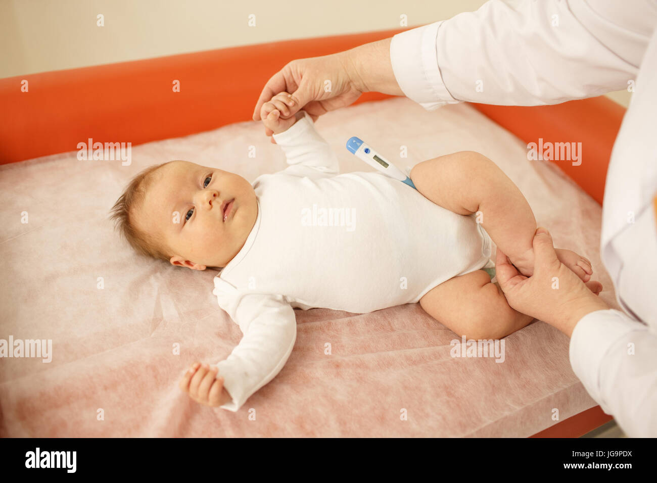 Pediatrician measuring baby's temperature Stock Photo Alamy