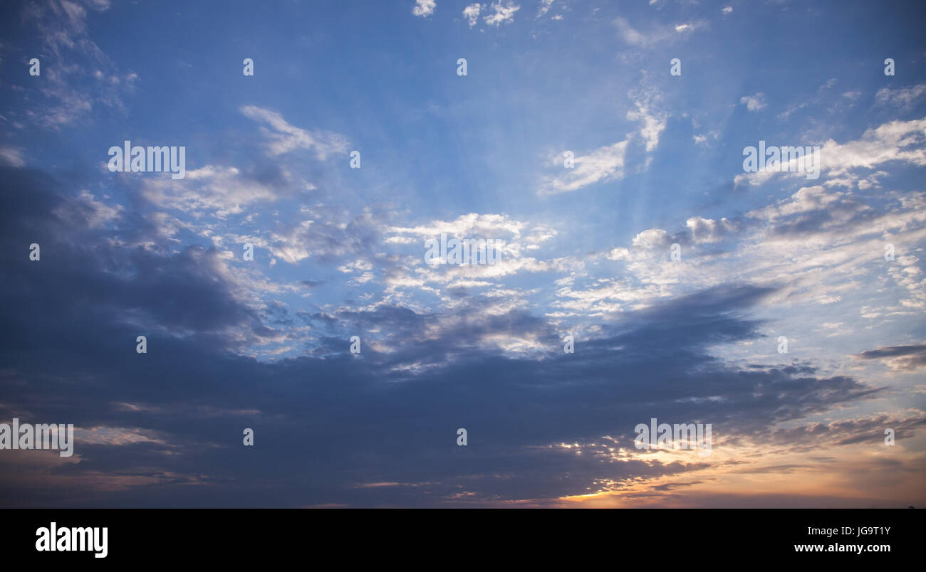 Colorful clouds in summer morning, background photo of bright tropical sky Stock Photo