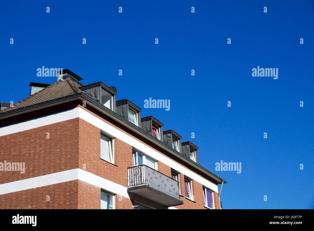 Top View Of New Construction Brick Wall Apartment With Dormer