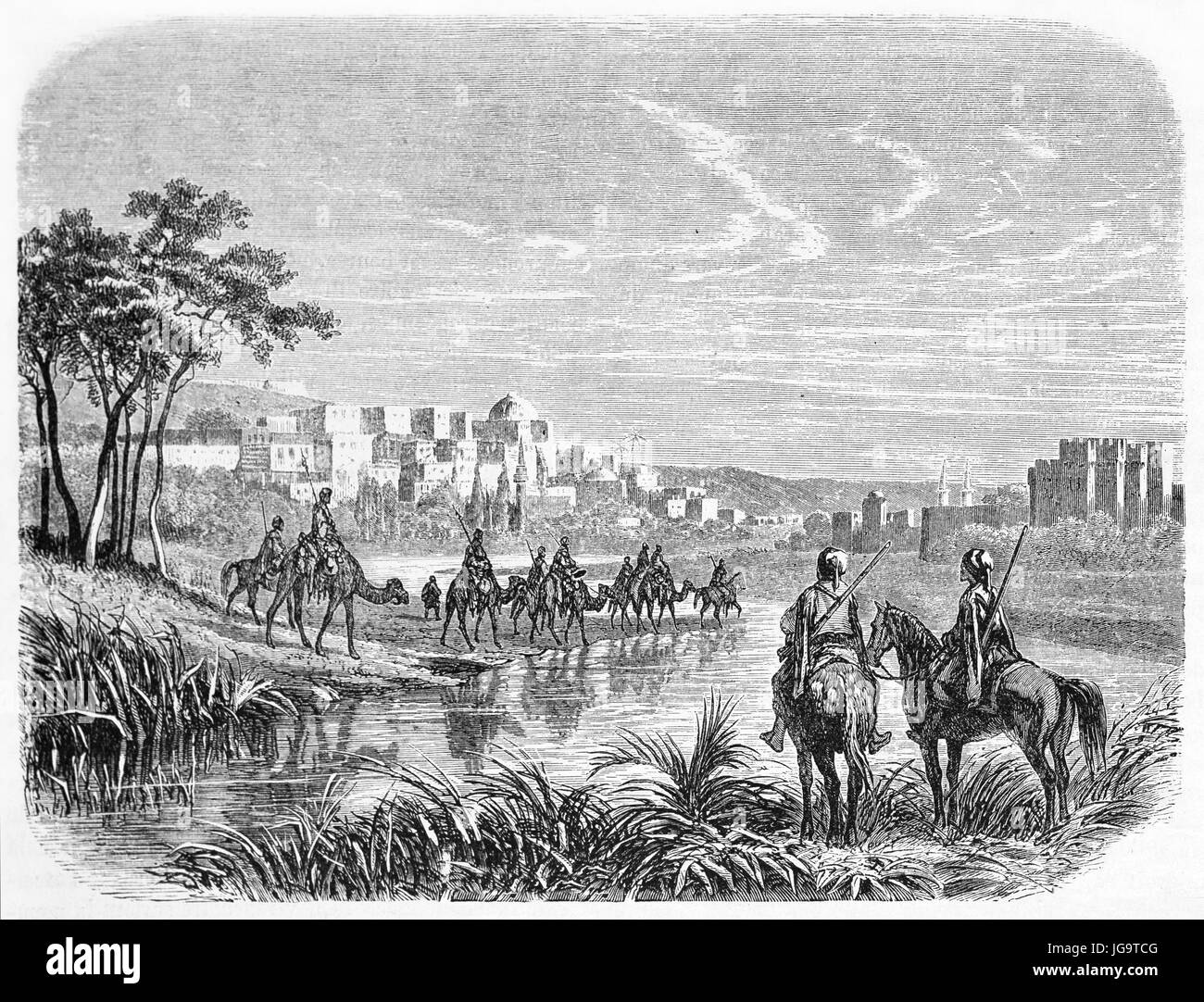 camelback and horseback people walking on a landscape towards Tripoli in the distance, Lebanon. Ancient grey tone etching style art by Grandsire 1861 Stock Photo