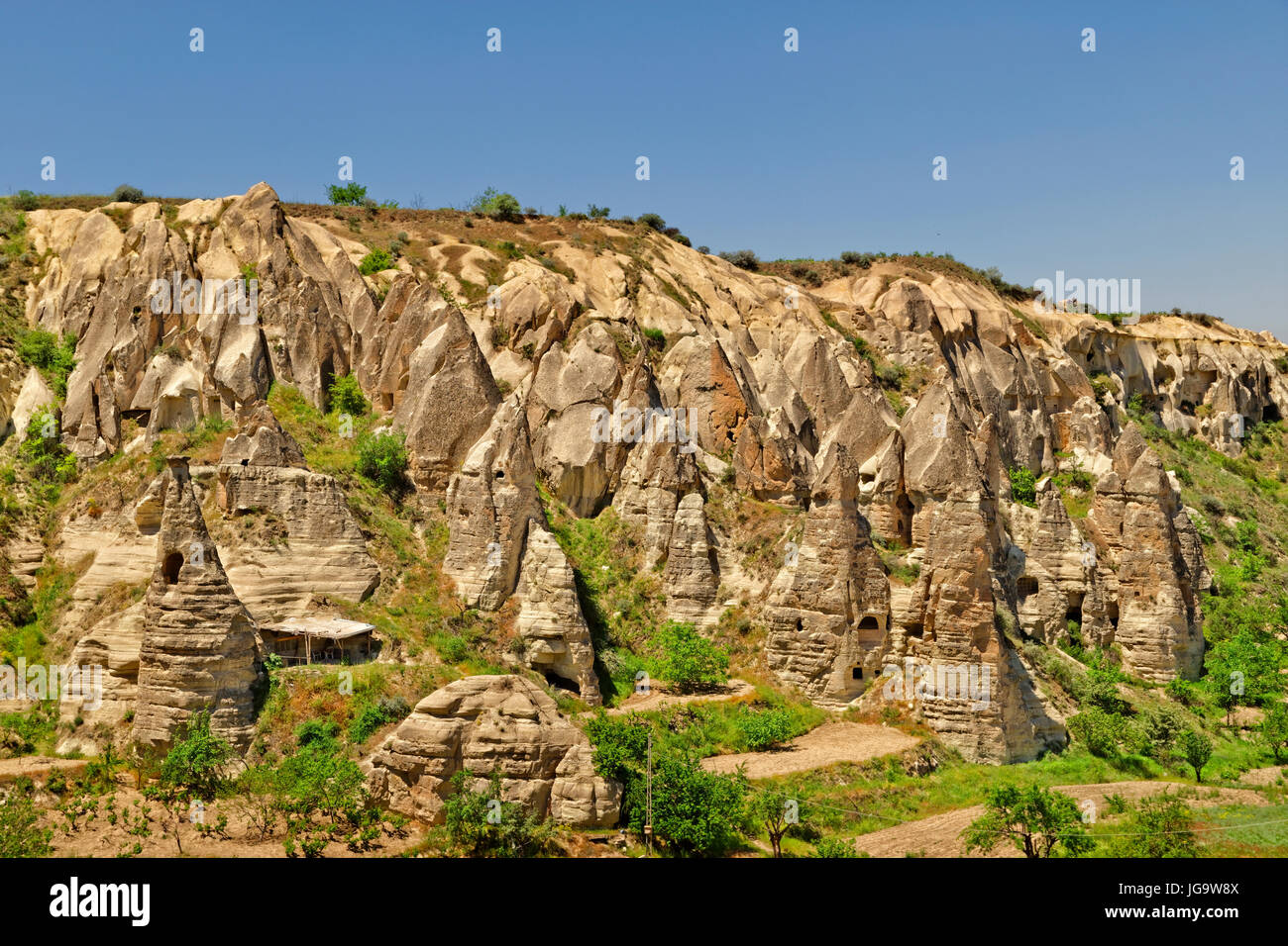 Cave dwellings and fairy chimneys at Goreme National Park, Cappadocia ...