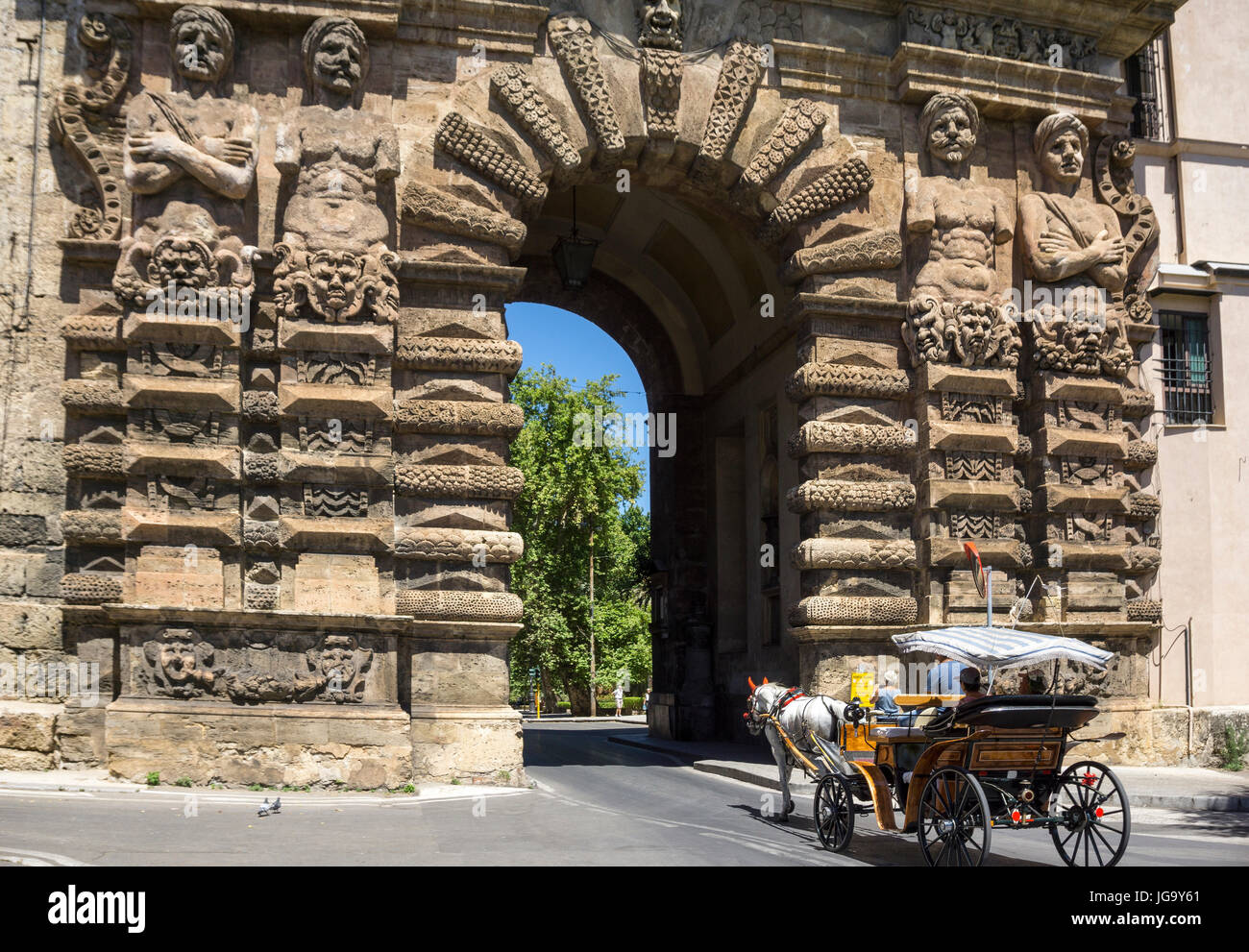 Horse and carriage passing through the 16th cen.  Porta Nuova on Corso Calatafimi. Palermo, Sicily, Italy. Stock Photo