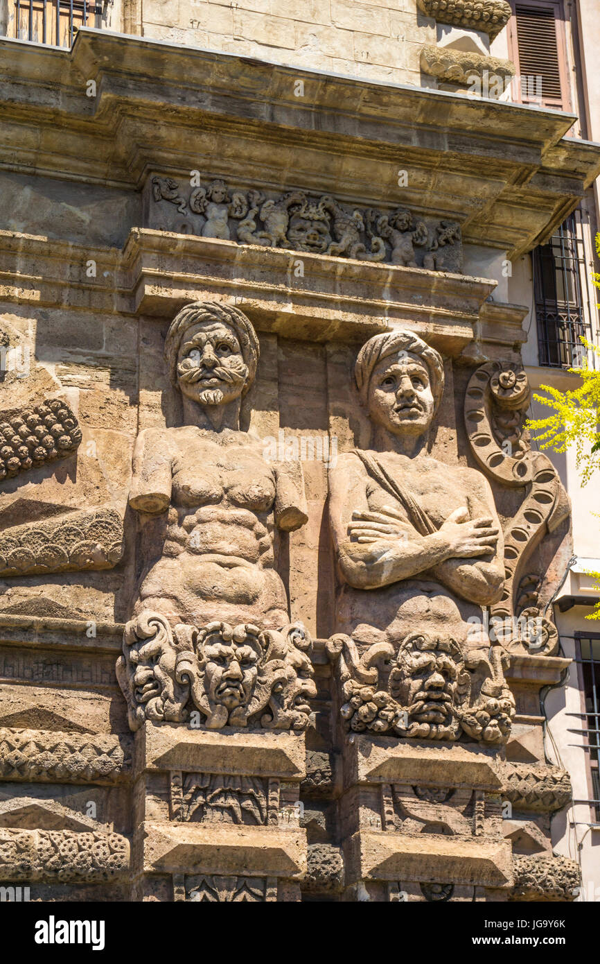 Sculptures, telamones, of Moorish prisoners, defeated by Charles V,  depicted on the 16th cen.  Porta Nuova on Corso Calatafimi. Palermo, Sicily, Ital Stock Photo