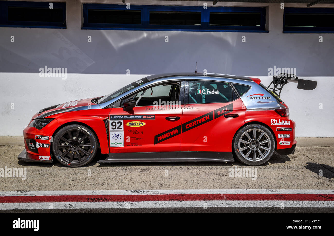 Seat Leon Cupra Cup red racing car parked in circuit pit lane, no people near vehicle Stock Photo