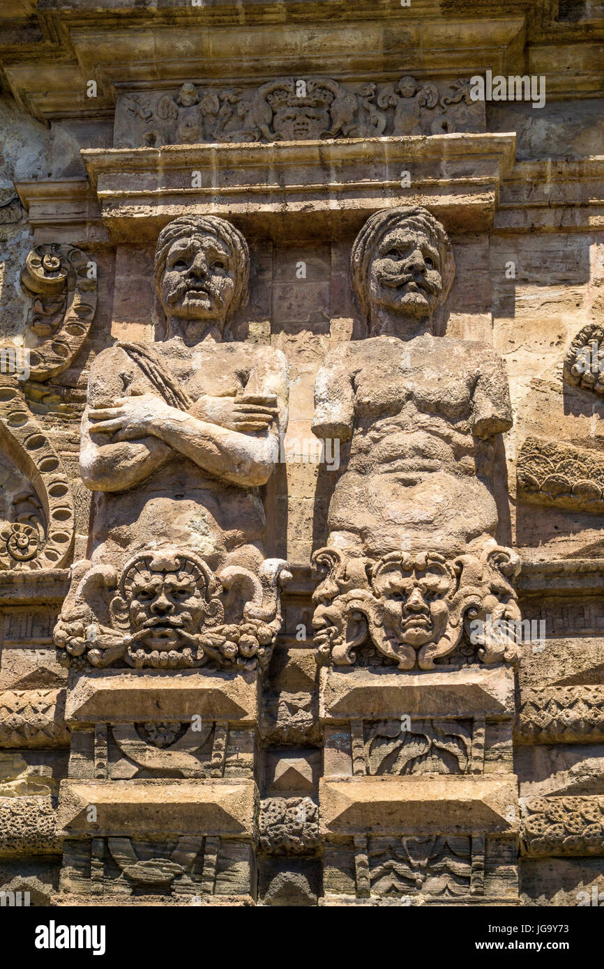 Sculptures, telamones, of Moorish prisoners, defeated by Charles V,  depicted on the 16th cen.  Porta Nuova on Corso Calatafimi. Palermo, Sicily, Ital Stock Photo