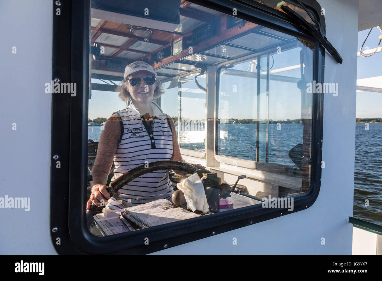 Oxford, Maryland - Marcia LoVerdi pilots the Bellevue-Oxford car ferry across the Tred Avon River near the Chesapeake Bay. LoVerdi has captained the f Stock Photo
