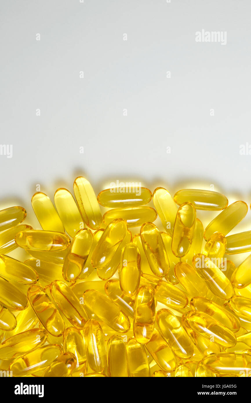 Fish oil gel capsules of omega 3. Copyspace added. Close up capsules fish oil on white background. The supplement high vitamin E omega 3 and DHA.Backg Stock Photo