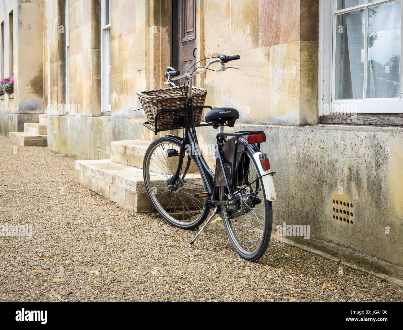 Student Bike outside college buildings at Downing College, part of the University of Cambridge, UK. Downing College was founded in 1800. Stock Photo