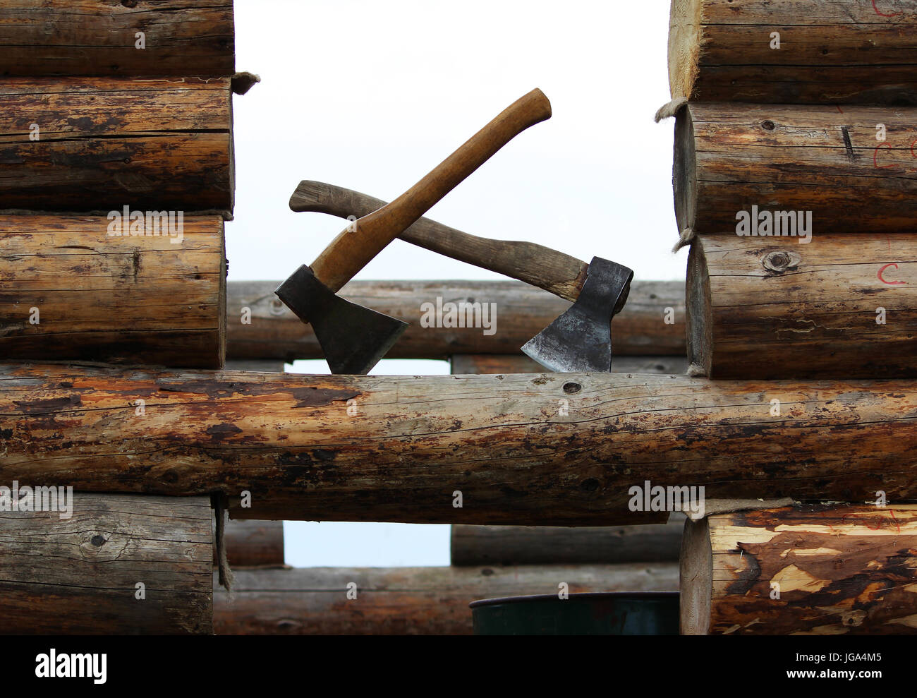 Building Axes Two axes on the when building a wooden house are ready for work Stock ...