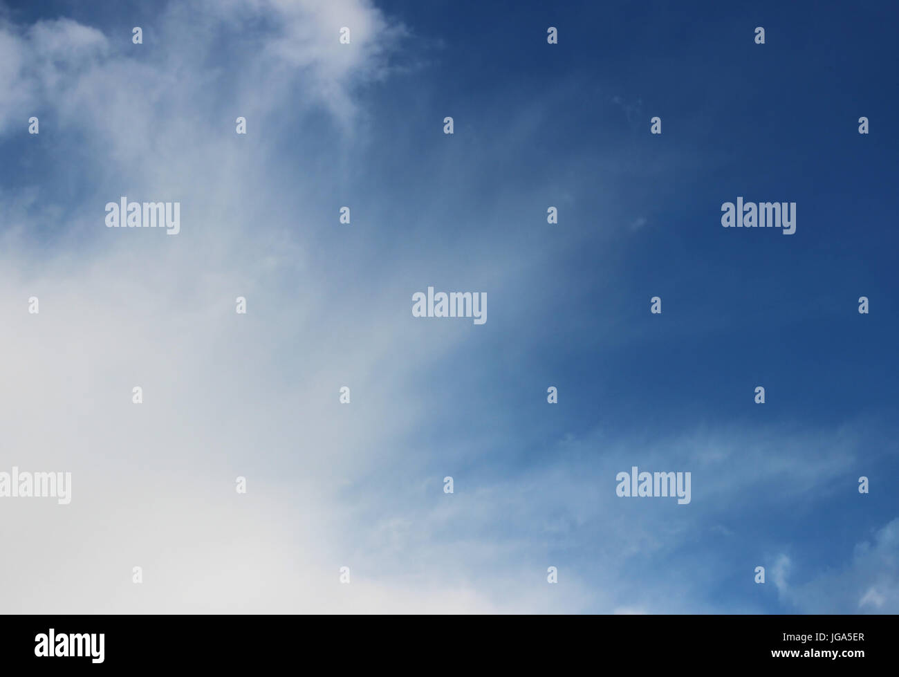 white clouds against the blue sky on a sunny summer day Stock Photo - Alamy