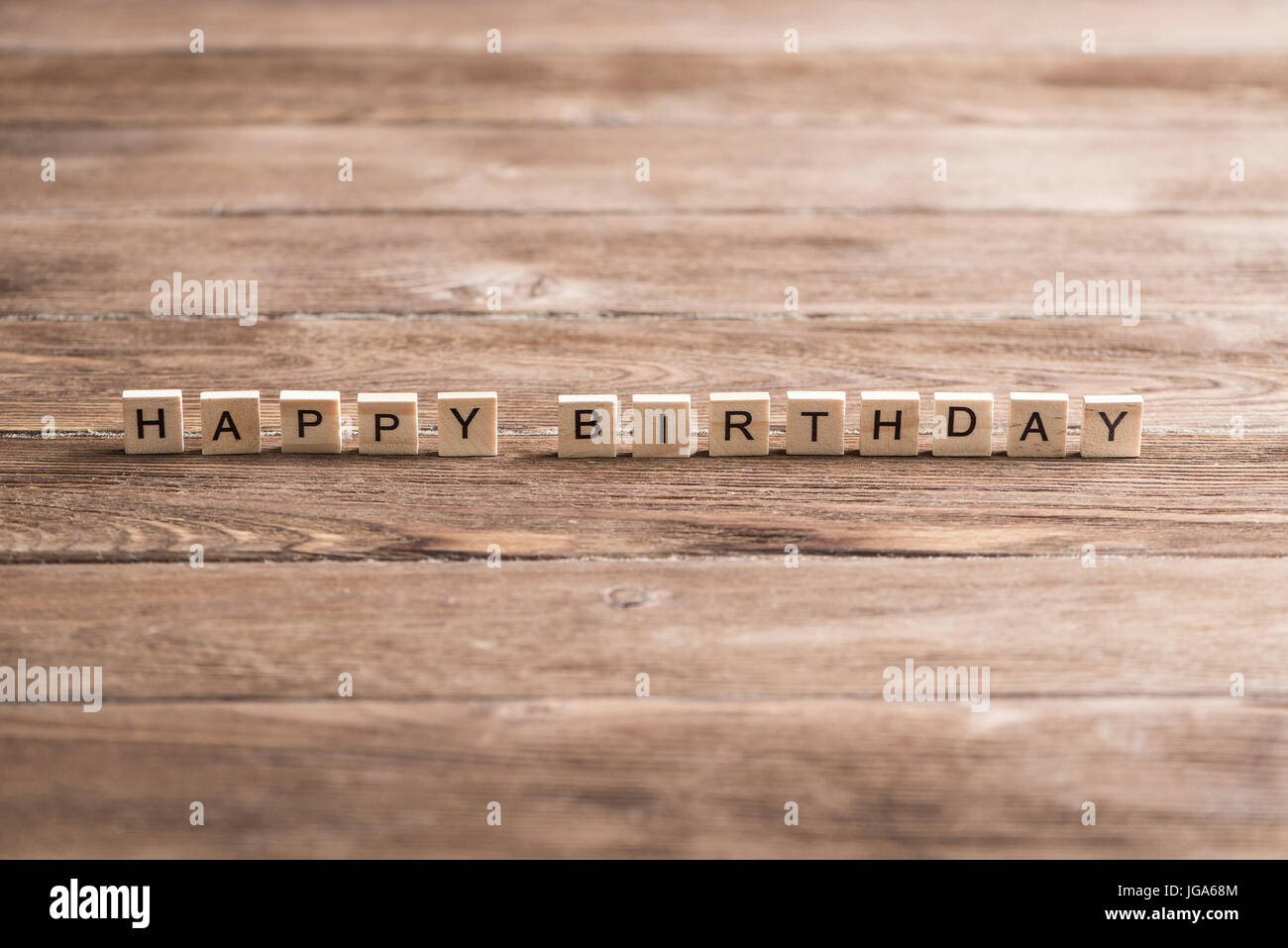 Alphabet letters on wooden pieces collected to word happy birthday ...