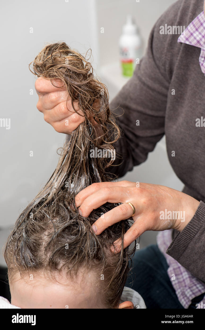 Treatment against lice on a child Stock Photo Alamy