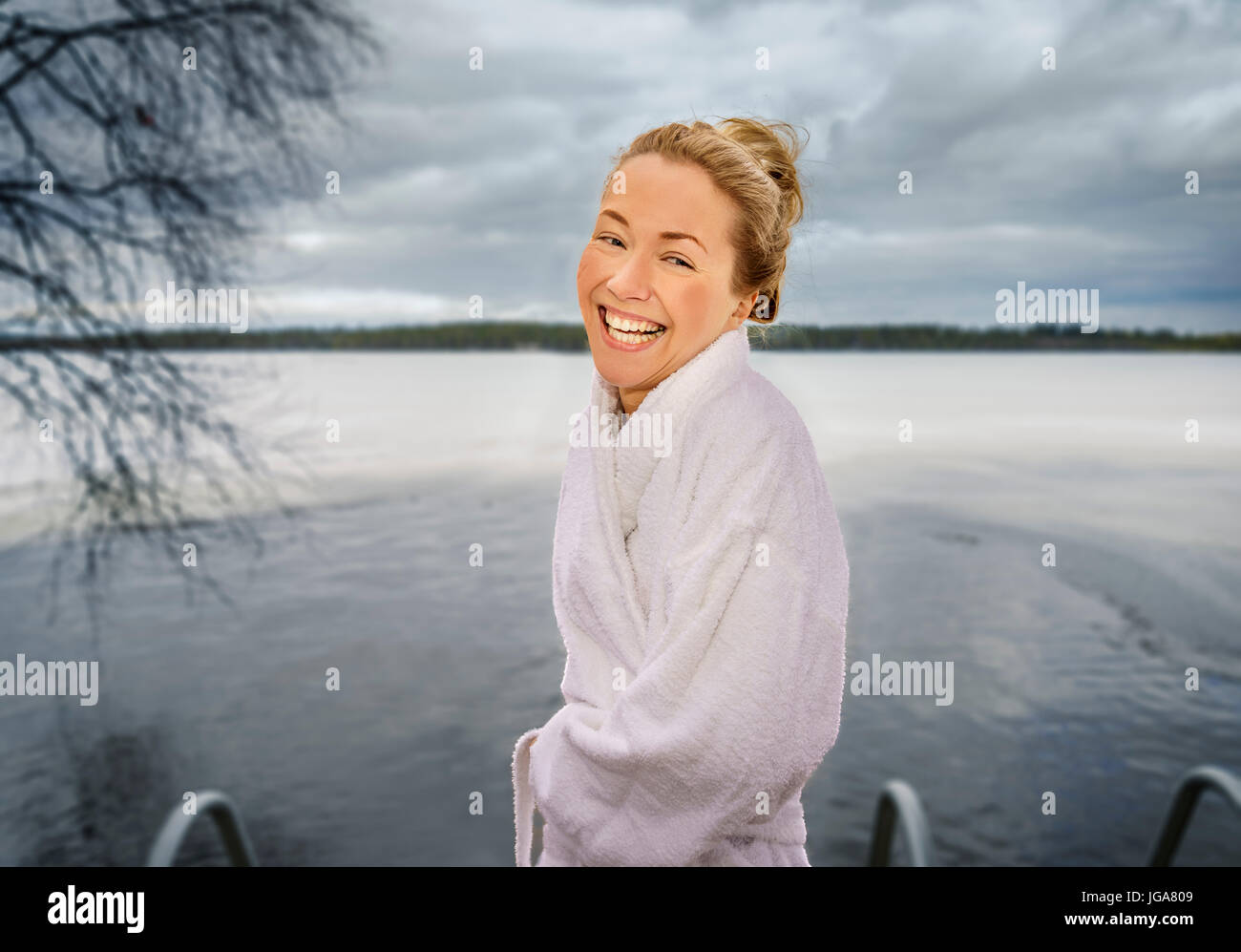 Woman winter swimming, Lapland, Finland Stock Photo