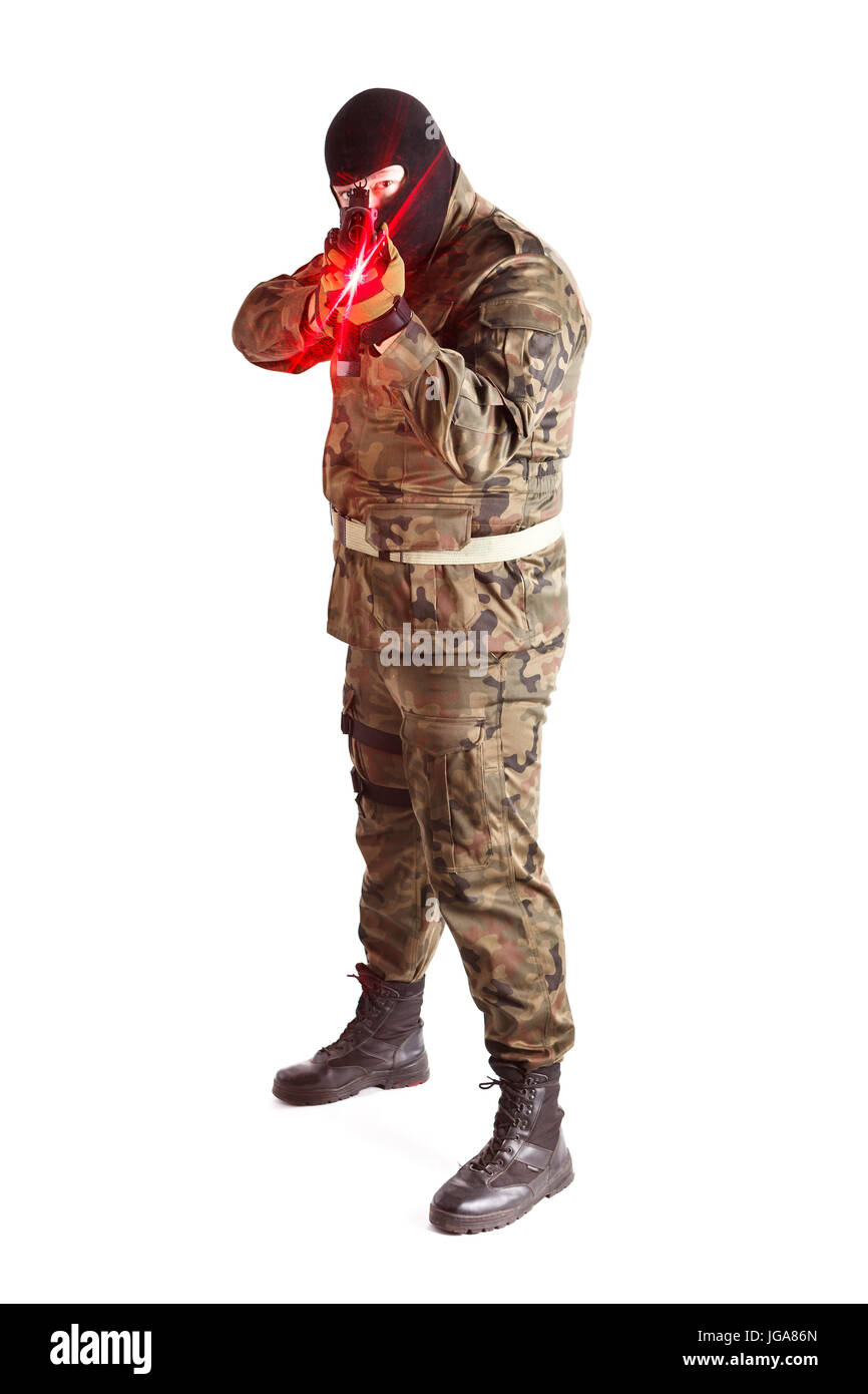 Anti terrorist aiming at camera with a gun equipped win laser target pointer, isolated on white background Stock Photo