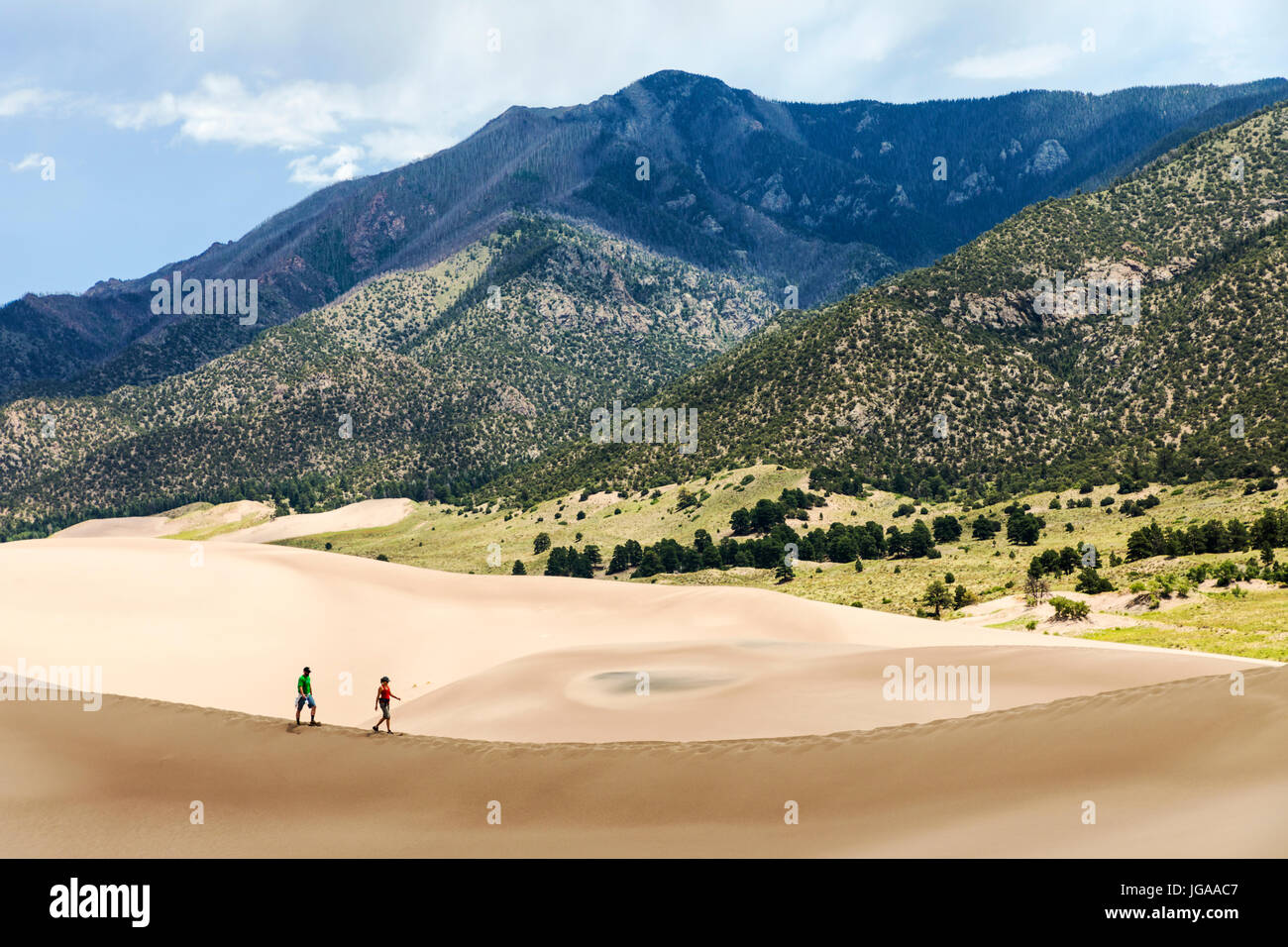 Visitors explore the Great Sand Dunes National Park & Preserve; San Luis Valley; Colorado; USA; 44,246 acres & the preserve an additional 41,686 acres Stock Photo