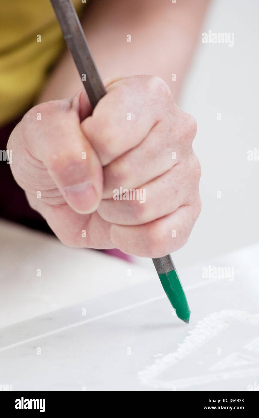 A Woman is Sculpting a Block of Marble Stock Photo Alamy