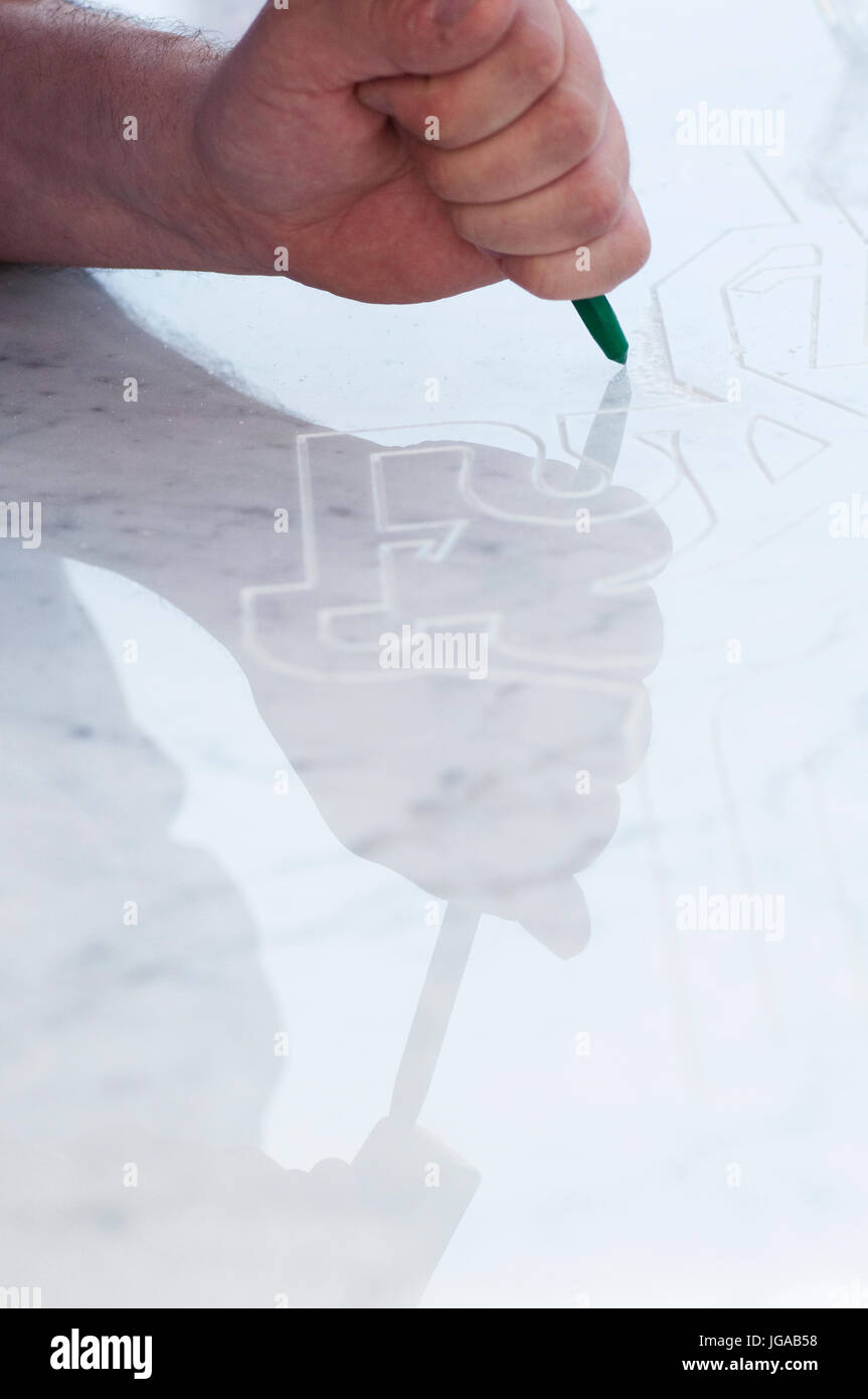 A Man is Sculpting a Block of Marble Stock Photo Alamy