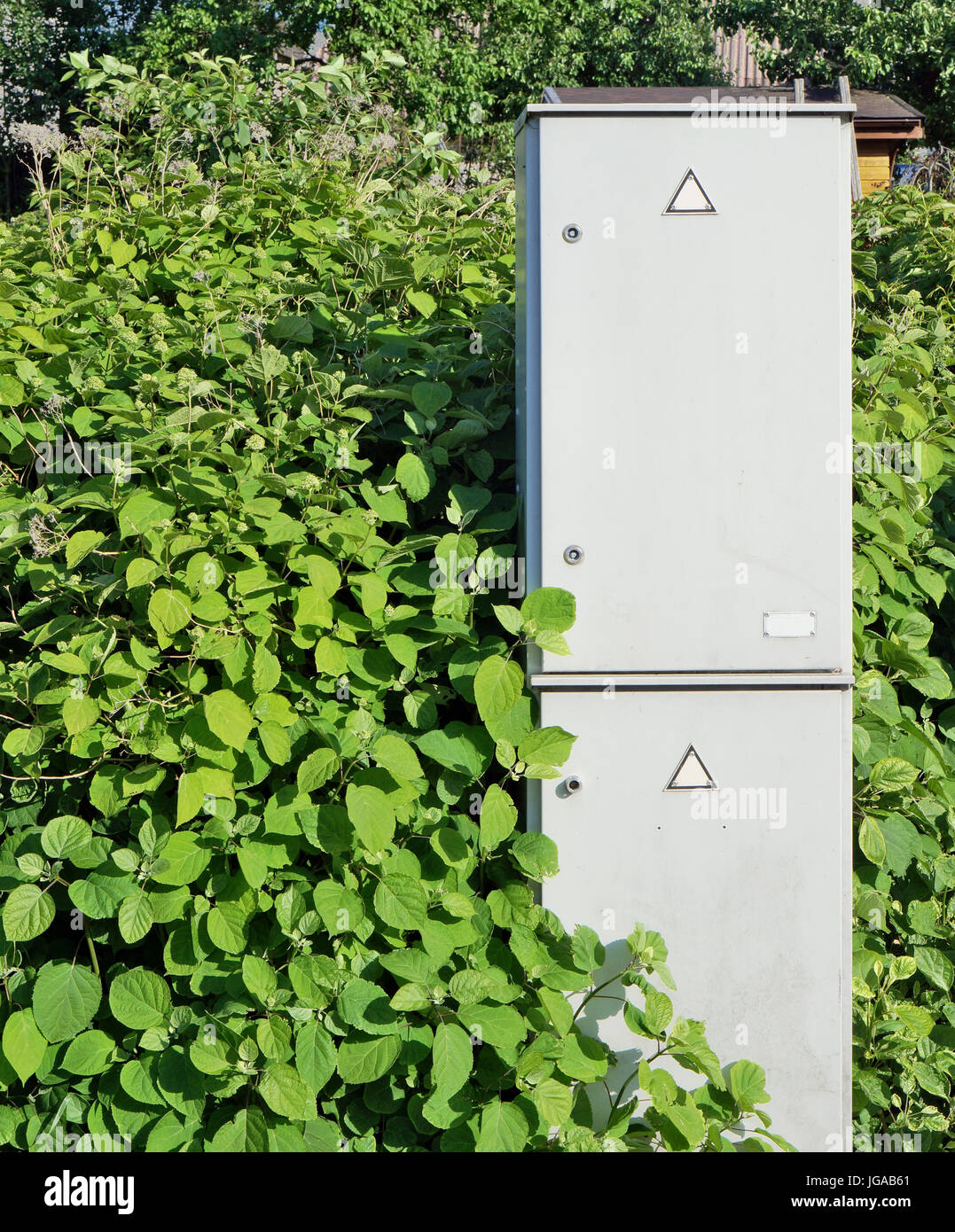 The concept of green electrical energy. Iron rural boxes for fuses and