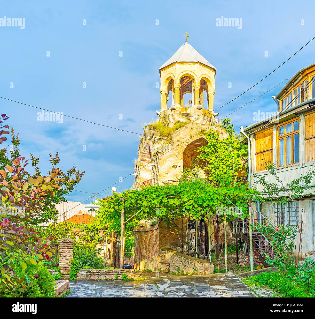 The old bell tower of Upper Bethlehem church, located in a quiet green street of Kldisubani neighborhood, Tbilisi, Georgia. Stock Photo