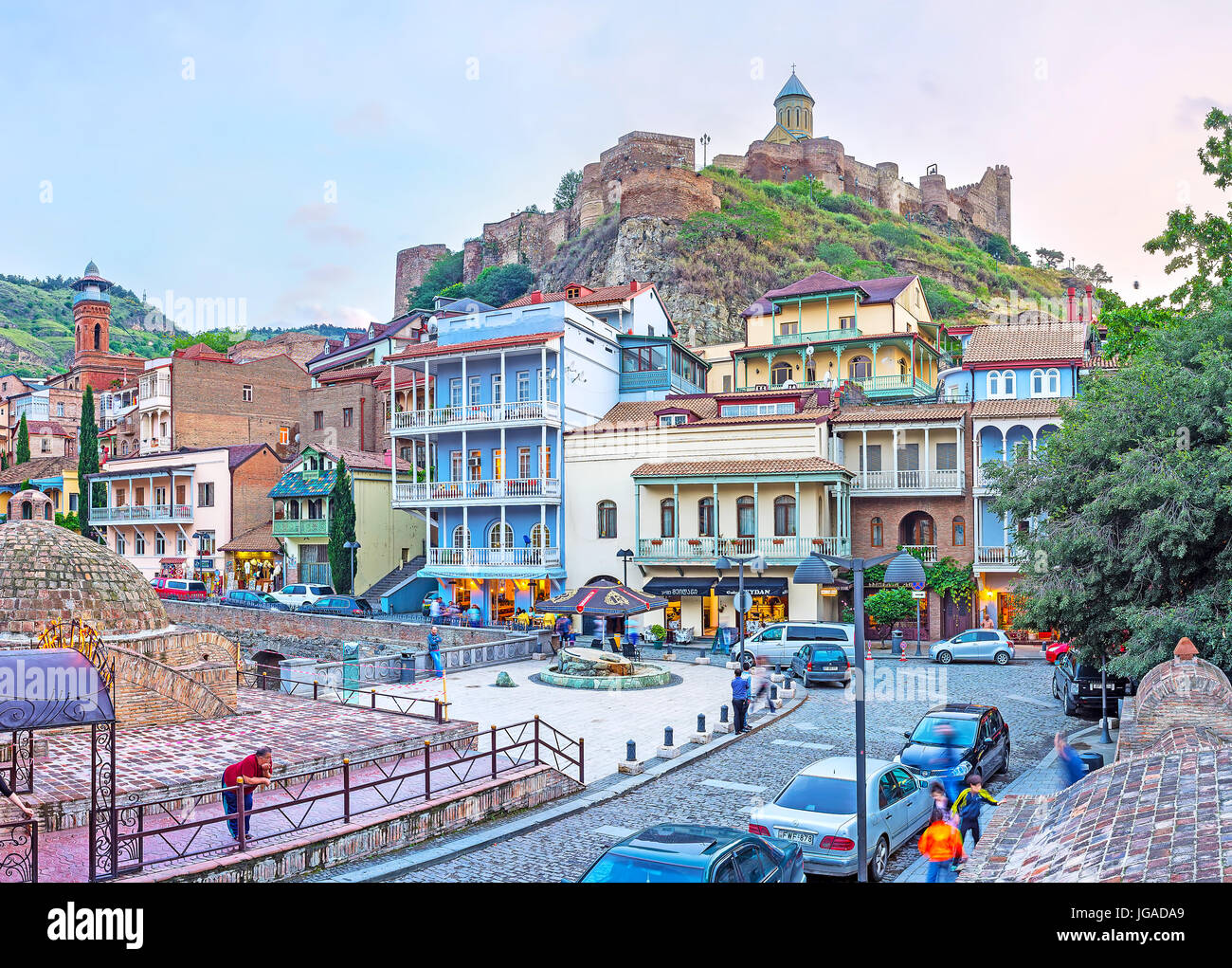TBILISI, GEORGIA - JUNE 5, 2016: The Sololaki hill, topped with Narikala fortress, is surrounded by the old quarters with scenic edifices and Sulphur  Stock Photo