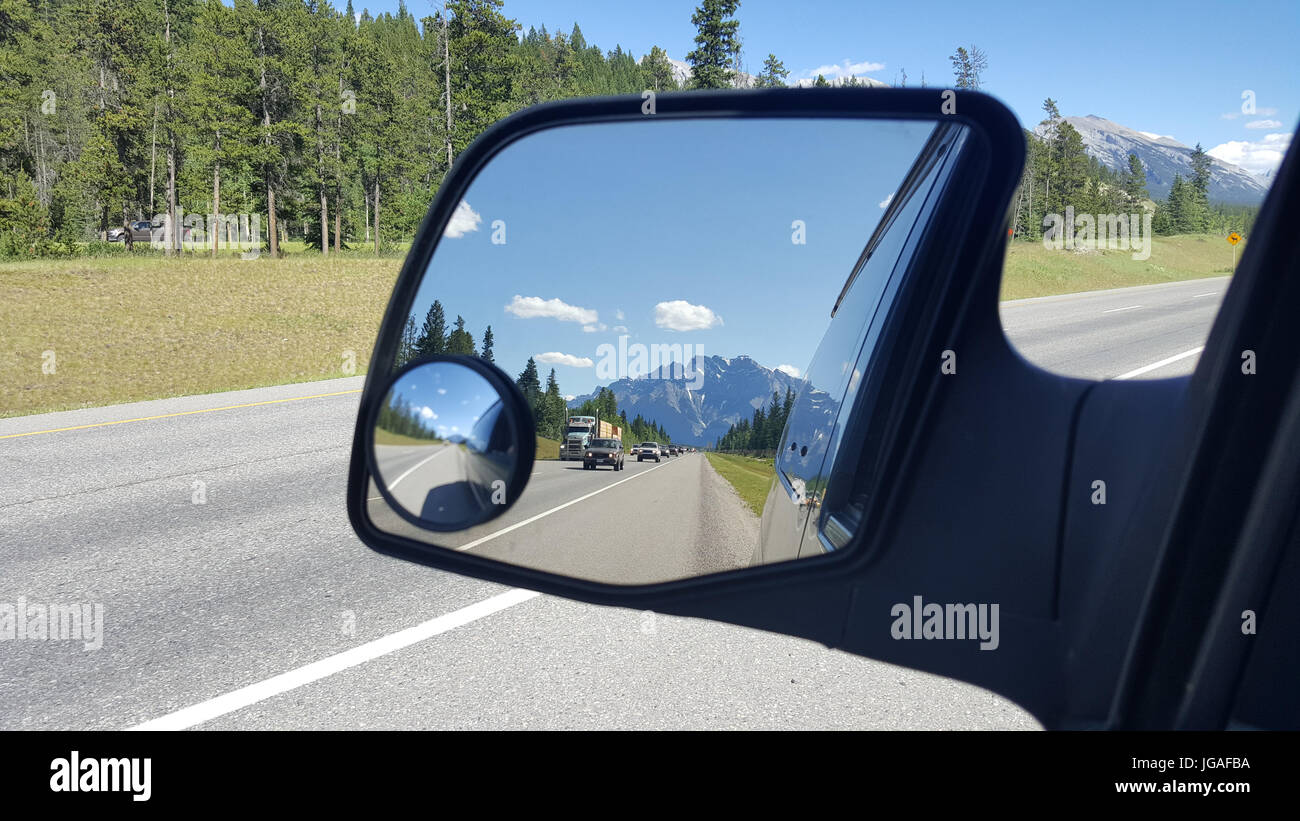 The Rockies in my rearview. MEET the woman who was so fed up of living payday to payday that she left her job and life in New Zealand to move more tha Stock Photo