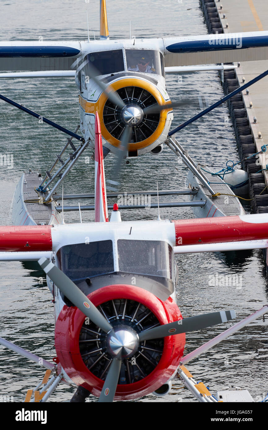 Iconic Vintage Harbour Air Seaplanes DHC-2 Beaver Floatplanes Moored At The Vancouver Harbour Flight Centre, British Columbia, Canada. Stock Photo