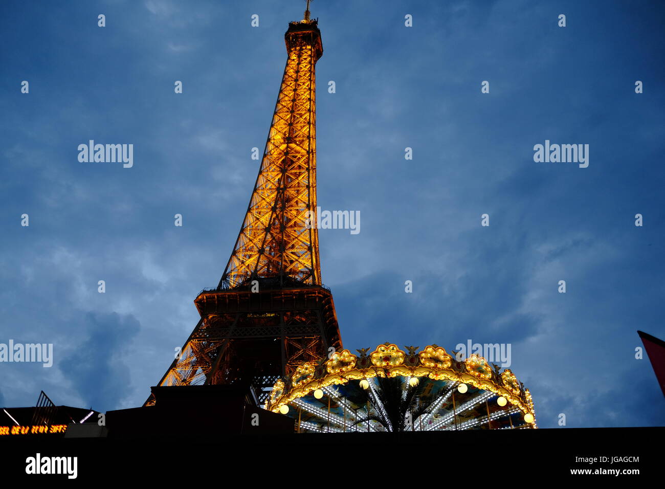 The Eiffel Tower Paris at night fall just as the lights go on Stock Photo