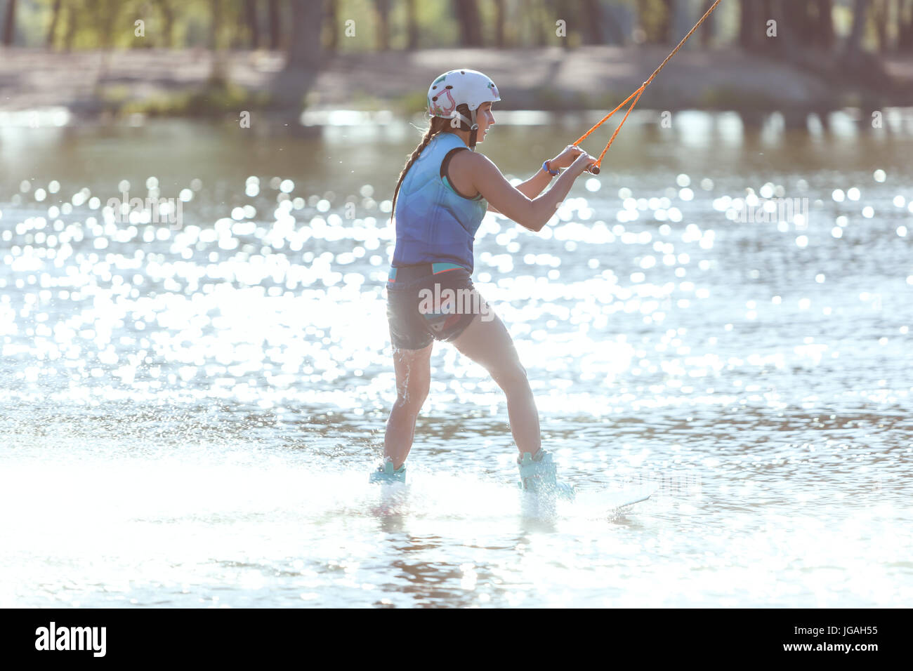 Woman skiing on water, summer fun and sports. Stock Photo
