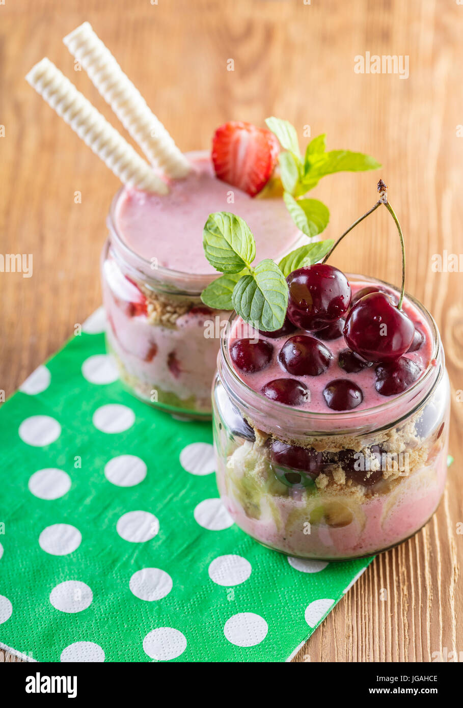 Fruit desserts in a jar on wooden background Stock Photo Alamy