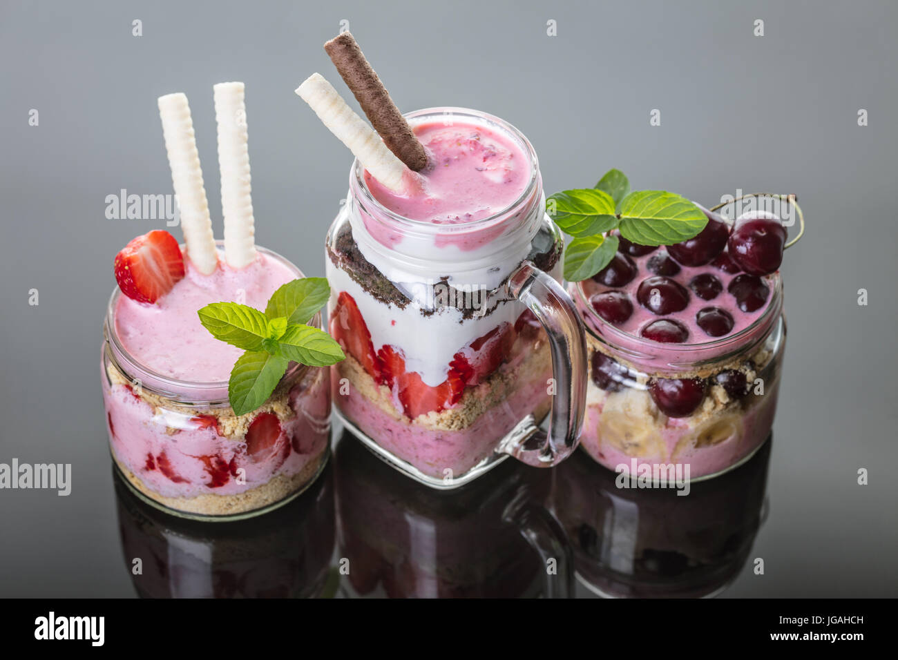 Fruit desserts in a jar on black background Stock Photo Alamy