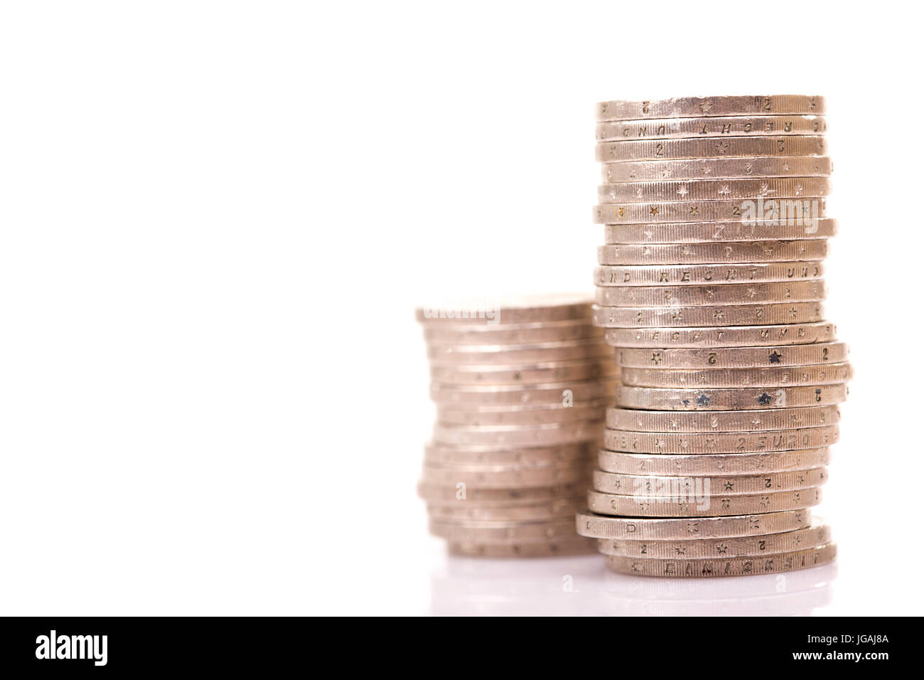 Heap of two euro coins isolated on white background Stock Photo - Alamy