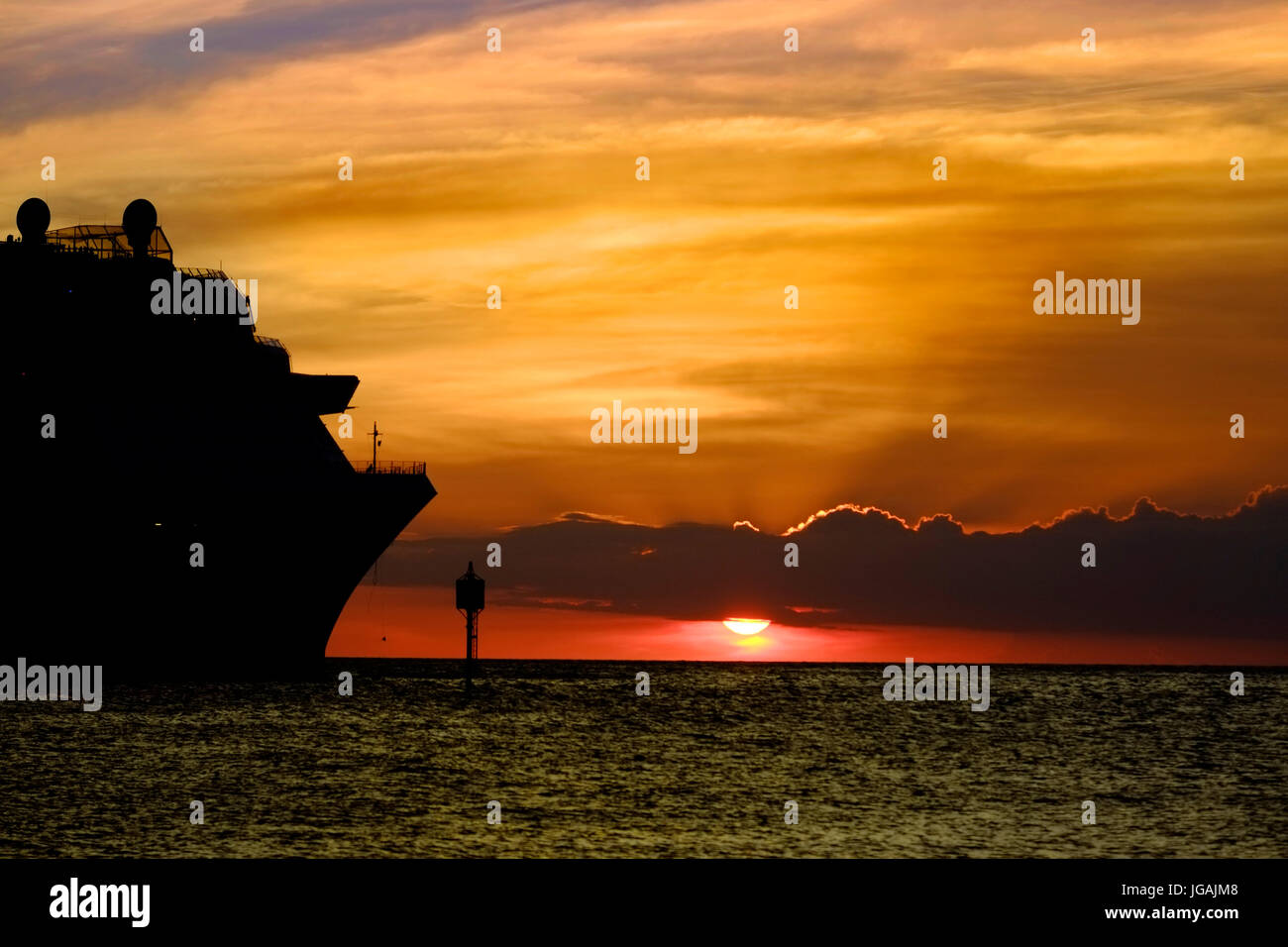 Willemstad, Curacao, Netherlands Antilles, Caribbean sunset on cruise ship silhouette Stock Photo