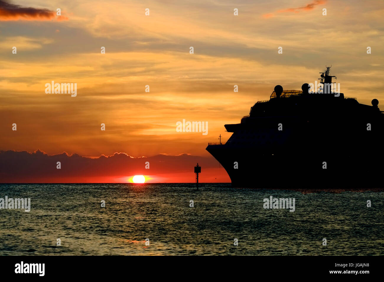 Willemstad, Curacao, Netherlands Antilles, Caribbean sunset on cruise ship silhouette Stock Photo