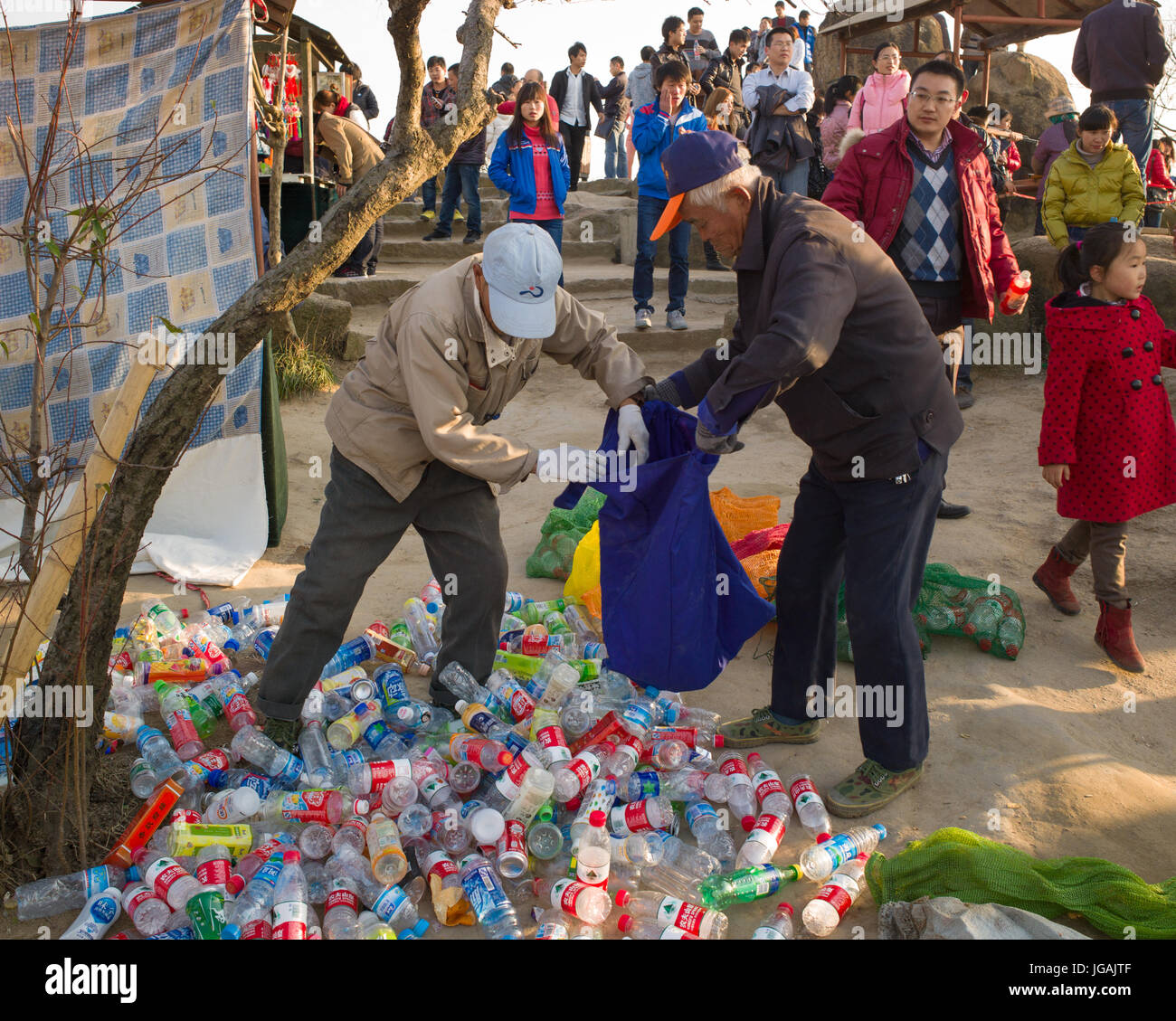People Collecting Plastic Bottles Recycling High Resolution Stock