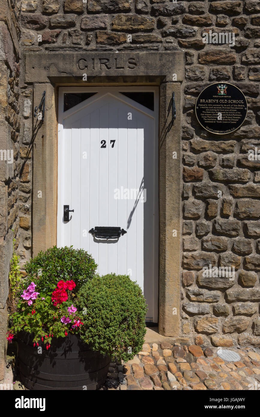 The Girls entrance to John Brabin's Schoolhouse on Windy Street in Chipping Lancashire Stock Photo