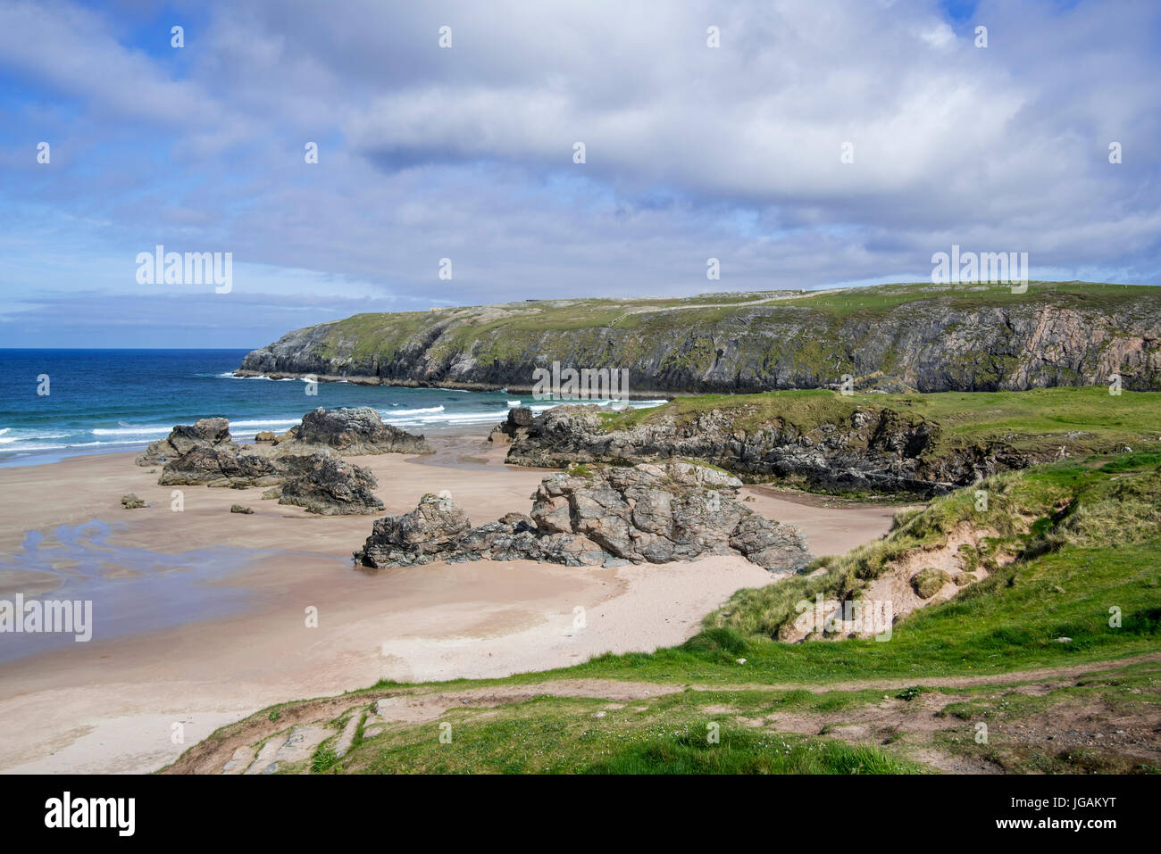 Sandy beach with rocks near Durness, Sutherland, Scottish Highlands, Scotland, UK Stock Photo