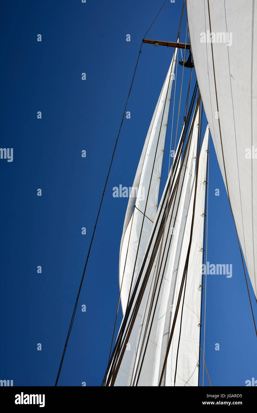 Astrid (Finland) TS 488 Gaff Ketch wooden sailing boat 1947 - view of the fore sails looking up against the sky Stock Photo